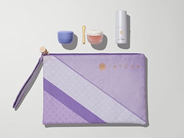 Travel Set Curator Pouch and Travel Size Dewy Skin Cream, Kissu Lip Mask and Silk Serum.